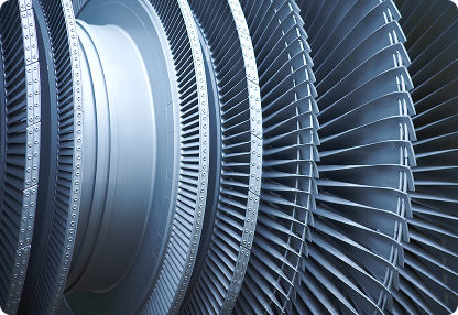 Close-up view of a metallic industrial turbine or jet engine component, showcasing detailed fan blades and circular structures.